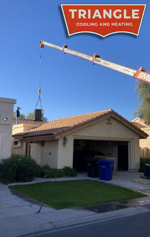Triangle Cooling and Heating installing a new HVAC unit on top of a home in Mesa, AZ.