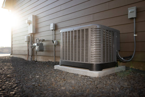 Air conditioning unit beside house